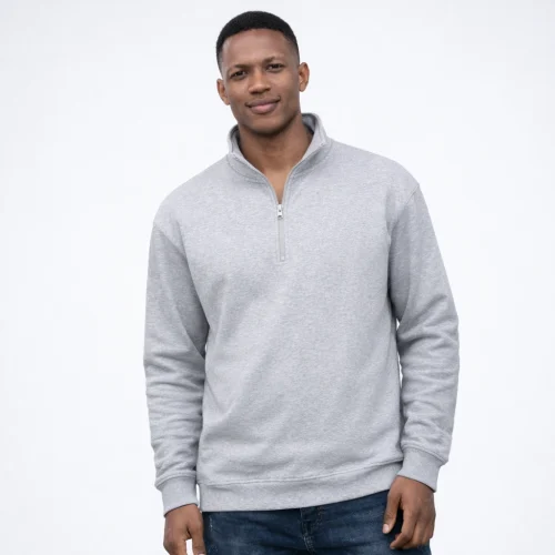 Man wearing a gray half-zip sweatshirt.