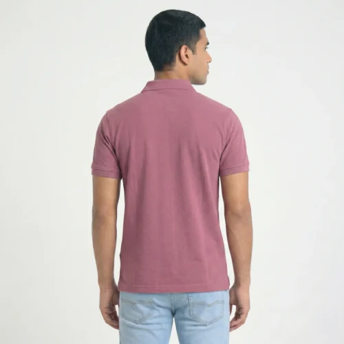 Man from behind, wearing a short-sleeve pink polo and light jeans.