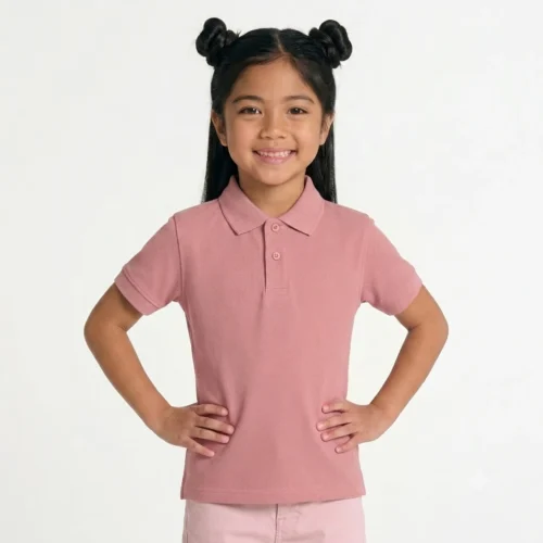 Smiling girl wearing a short pink polo.