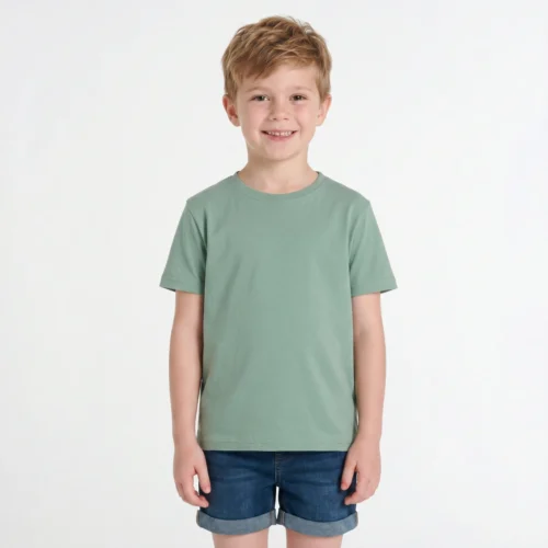 Boy wearing a green t-shirt and jeans.